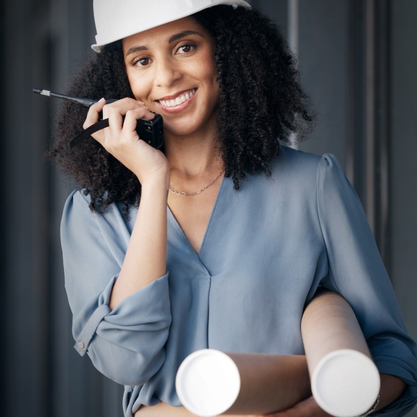 Engineer, black woman and walkie talkie with documents tube for engineering or architecture industr.